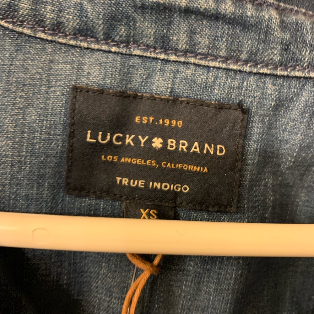 Lucky denim dirt dress with uneven, frayed hem.